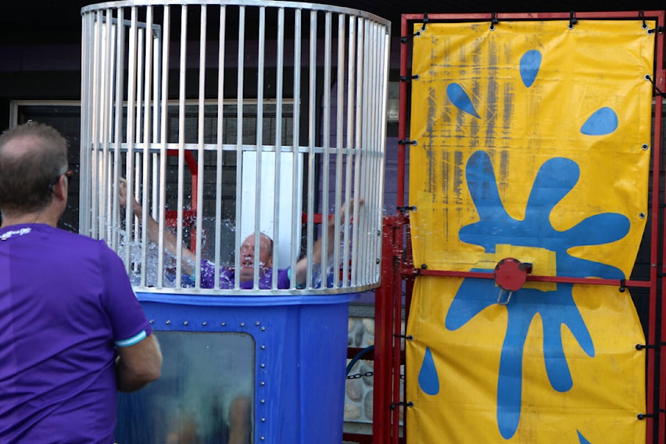 Langford Mayor Stew Young dunks Jeff King in the dunk tank, which was part of Pacific FC’s day of activities to raise money for Help Fill a Dream at Starlight Stadium on Sept. 18. (Bailey Moreton/News Staff)