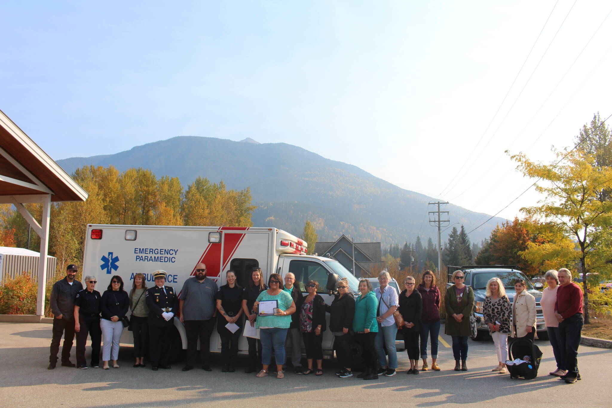 Roberta Cameron alongside her parents, family members and friends attended the ceremony, as well as the responding paramedics and area manager. (Josh Piercey/Revelstoke Review)