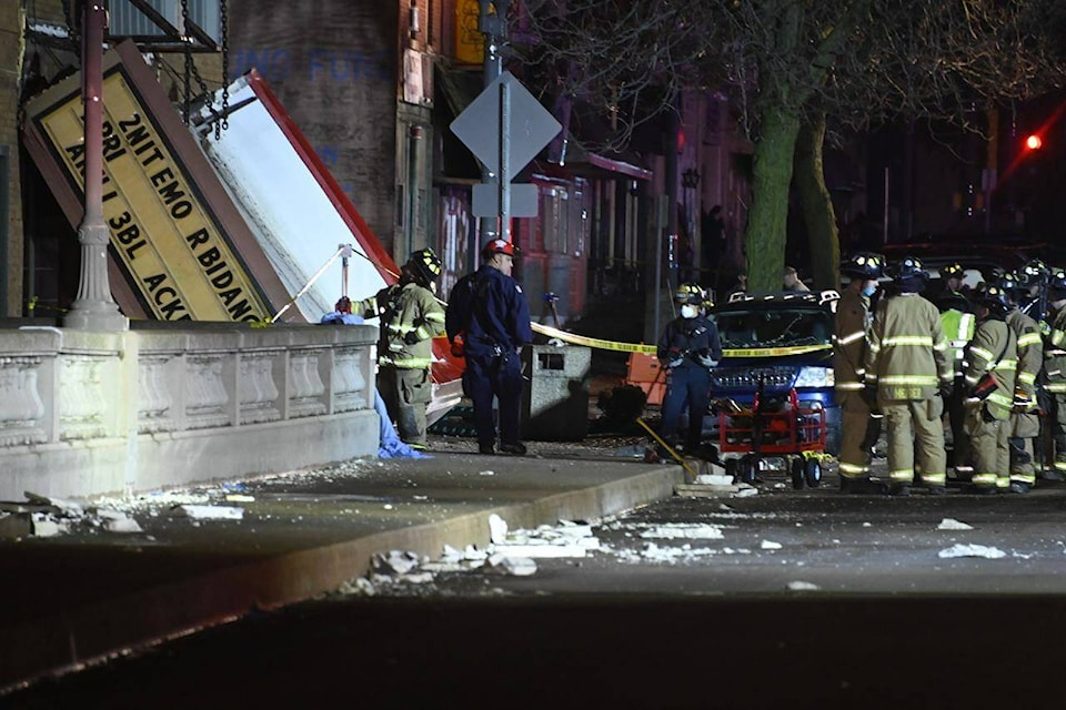 Authorities work the scene at the Apollo Theatre after a severe spring storm caused damage and injuries during a concert, late Friday, March 31, 2023, in Belvidere, Ill. (AP Photo/Matt Marton)