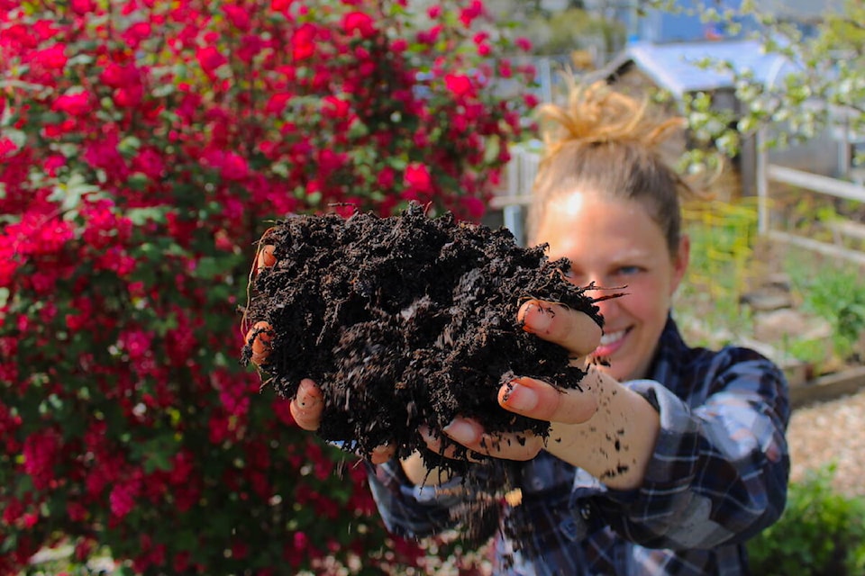 The Compost Education Centre’s Kayla Siefried holds some of the nutrient and microbe-packed compost created at the Victoria non-profit. (Jake Romphf/News Staff)