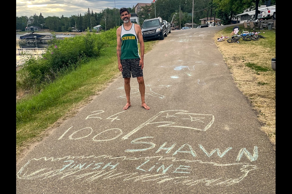 Shawn O'Hara crossing the finish line after a 24 hour marathon he ran at Rochon Sands.