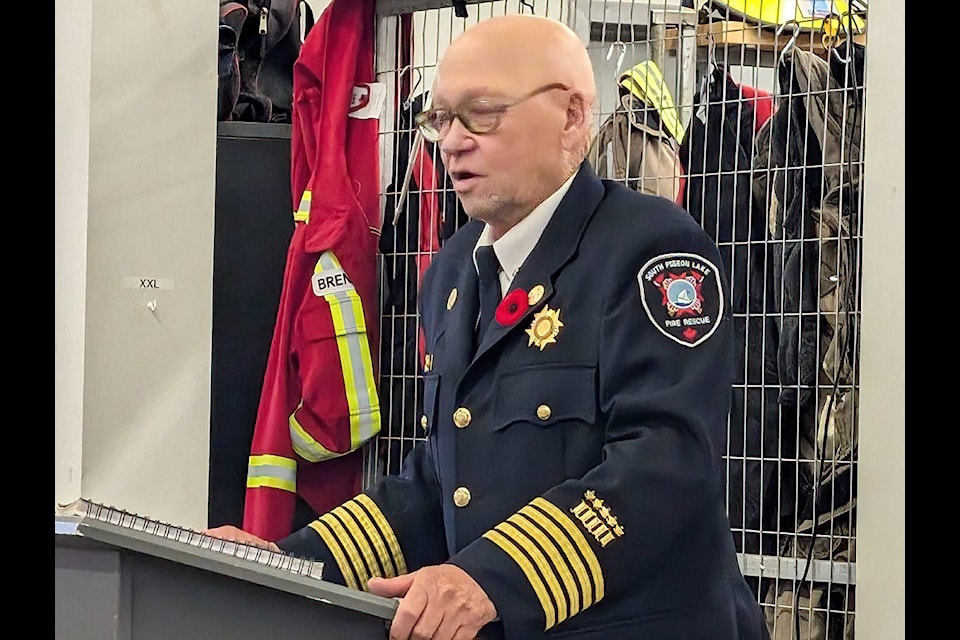 Fire Chief Wayne Benson says a few words at the ceremony recognizing his 50 years of service as a volunteer firefighter.