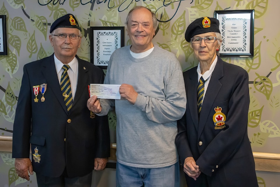 Legion members Ray Cerniuk (left) and Pat Lattery (right) present a cheque of $900 to Stan Botsford, a resident at Points West accepting the funds on behalf of the Eden Resident Social Committee.