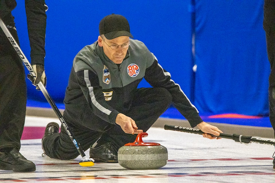 A team King member throws during the second end.