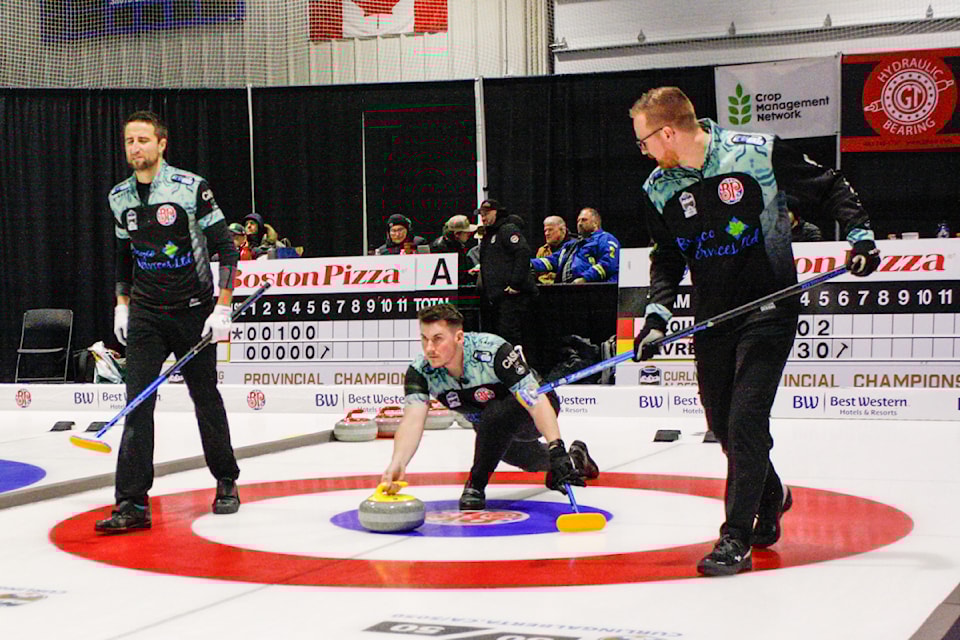 Team Vavrek slides out of the hack during the 4th draw of the Boston Pizza Cup.