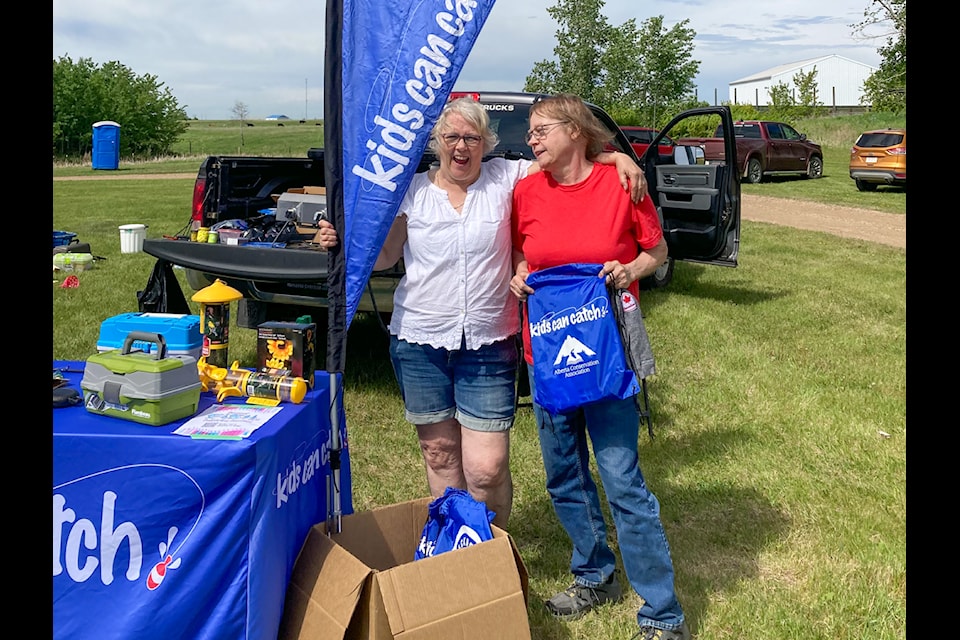 FCSS Director Mandy Fuller helped organize the fishing day in Castor. Here she is with FCSS board member Rose Koenraadt.
