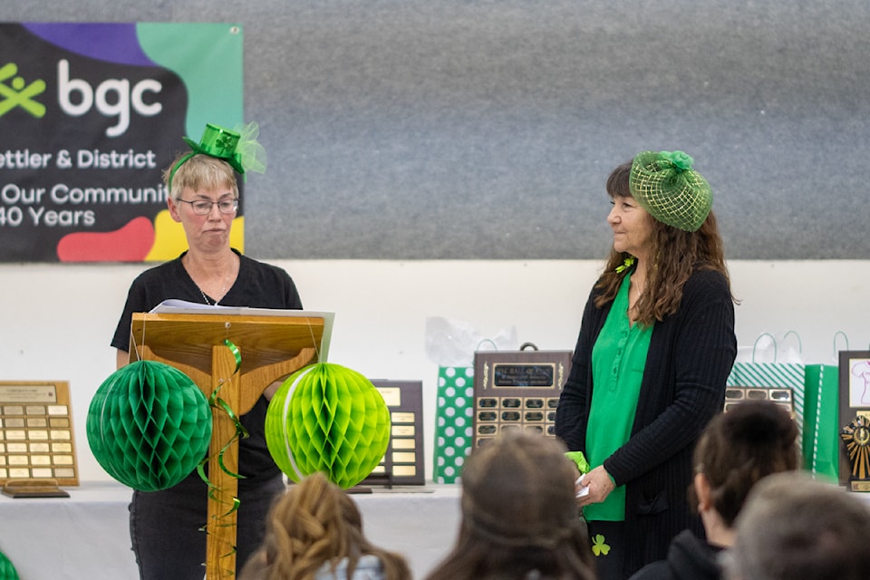Executive Director Winnie Bissette honours decade-long staff member Pat Wood.