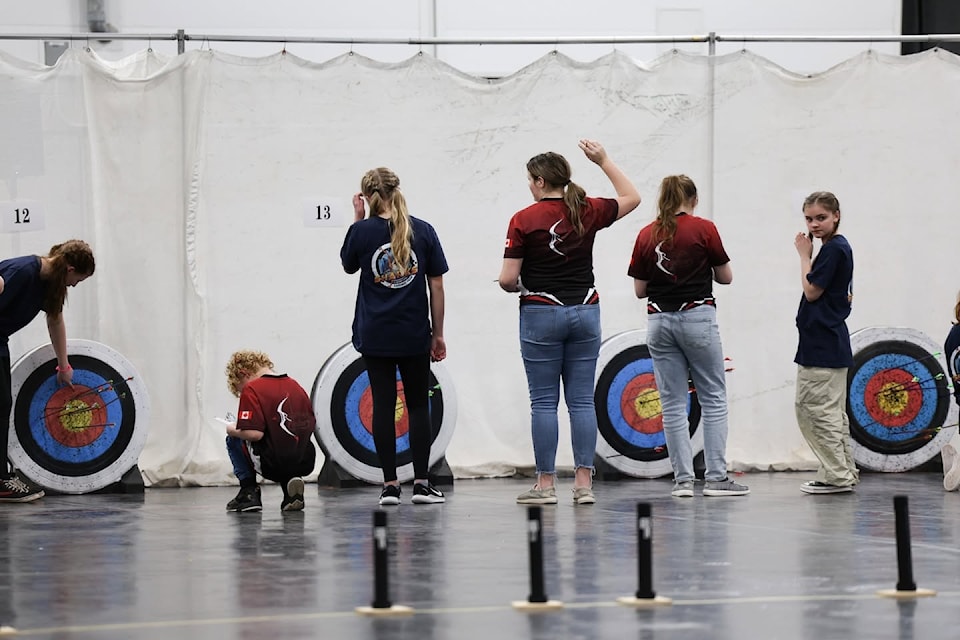 Castor archers check their targets at provincials in Edmonton. 