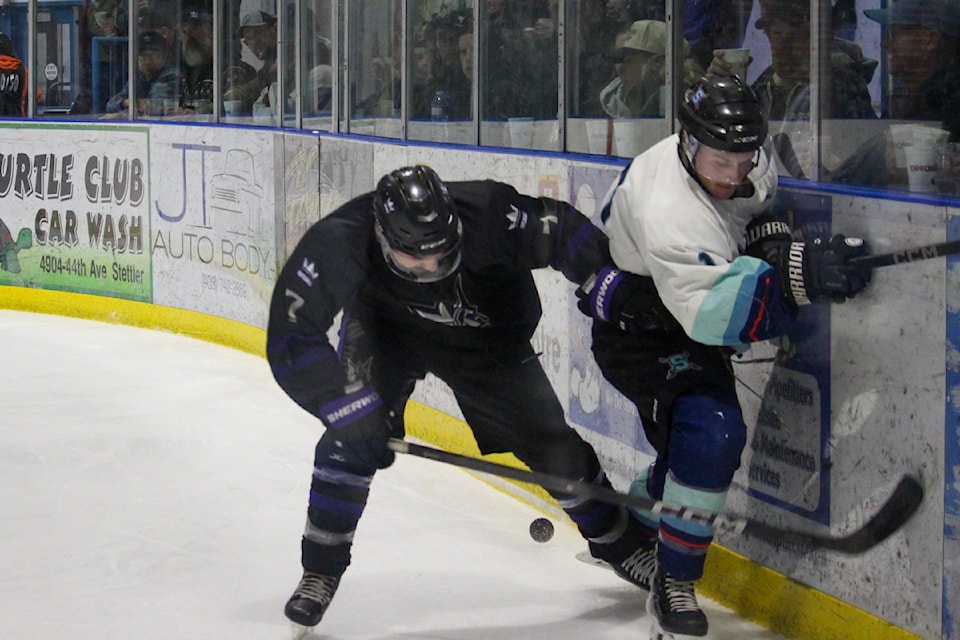 Imperials Brendan Bardwell battles a Sedgewick player for the puck.
