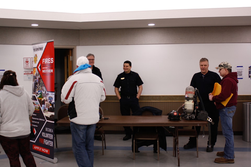 Some residents check out the table set up by the Stettler Regional Fire Department.