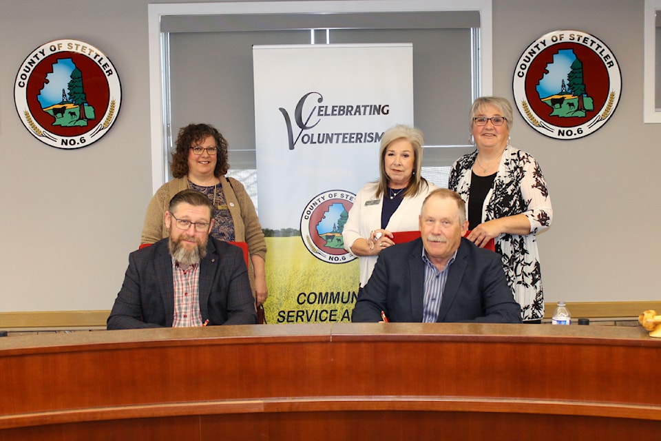 Mayor Sean Nolls and Reeve Larry Clarke (front left and right) have proclaimed Volunteer Week in Stettler Town and County. Witnessing the proclamation were Terry Visser; Stettler Home Support, Shelly Walker; Stettler FCSS, Lorraine Hankins; Stettler Volunteer Centre (left-right).
