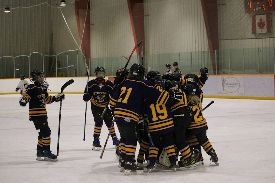 The Stettler Storm celebrate their 10-4 win over Lacombe. (Kevin Sabo/BLACK PRESS NEWS MEDIA)