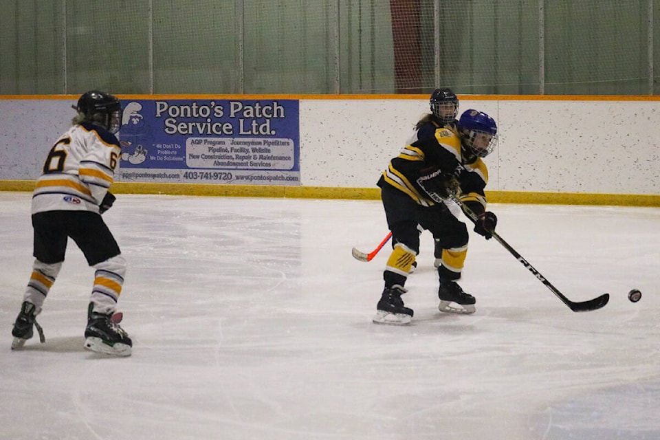 A U11 Olds Grizzly girl manages a shot on net in the team’s 6-1 victory over the Stettler Storm on Feb. 11, 2022. (Kevin Sabo/BLACK PRESS NEWS MEDIA)