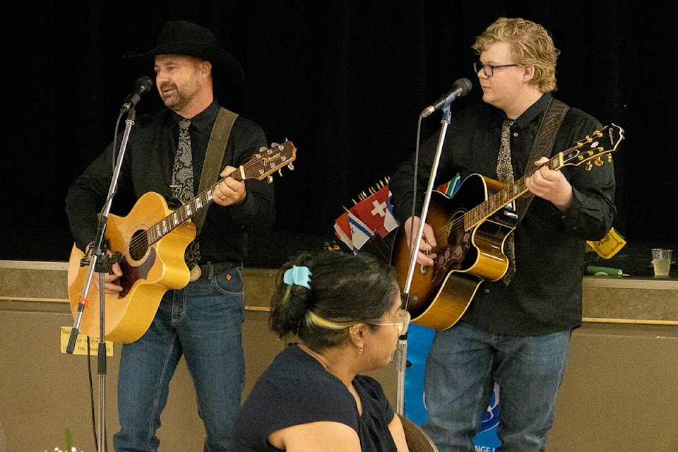 Kent and Josh Nixon provided the entertainment at the Stettler Rotary Club Farmer Appreciation Supper on June 20. (Kevin Sabo/Stettler Independent)