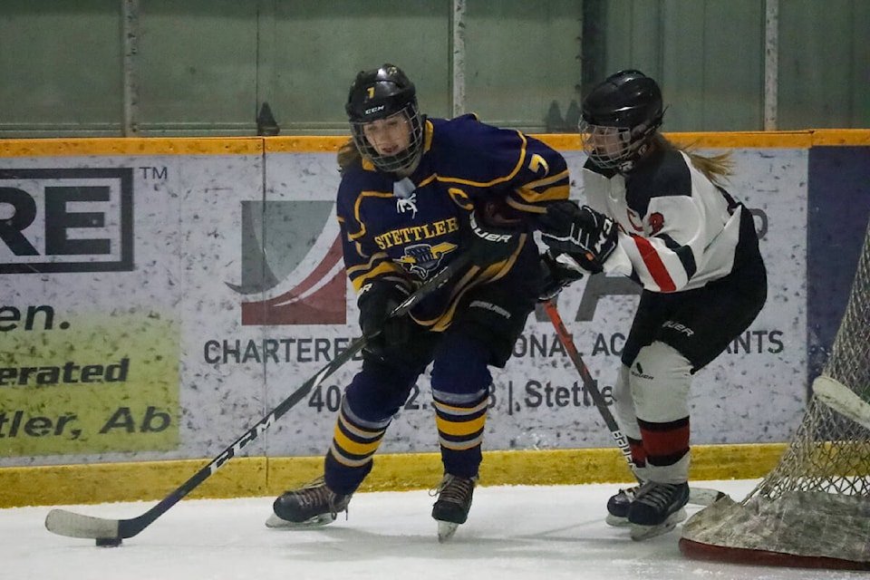 Puck battle behind the net! Stettler Storm U18 females take on Lloydminster on Nov. 25. (Kevin Sabo/Stettler Independent)