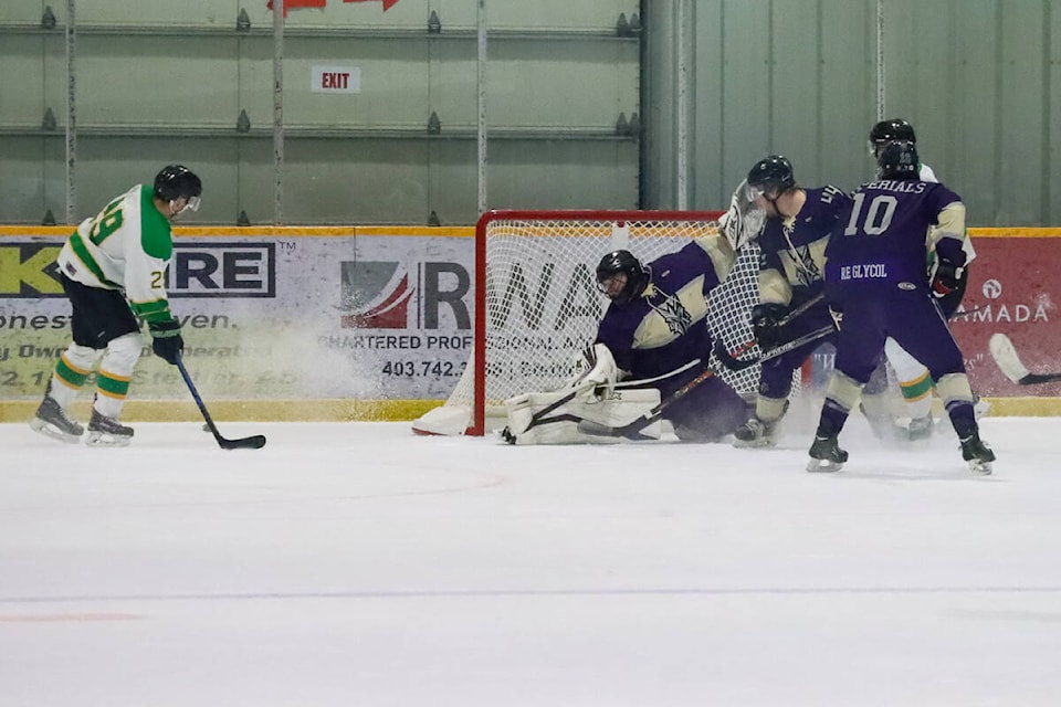 Imperials goalie Jordan McCallum makes another save as Provost Combine forward Carter Trenerry moves in on the net. (Kevin Sabo/Stettler Independent)
