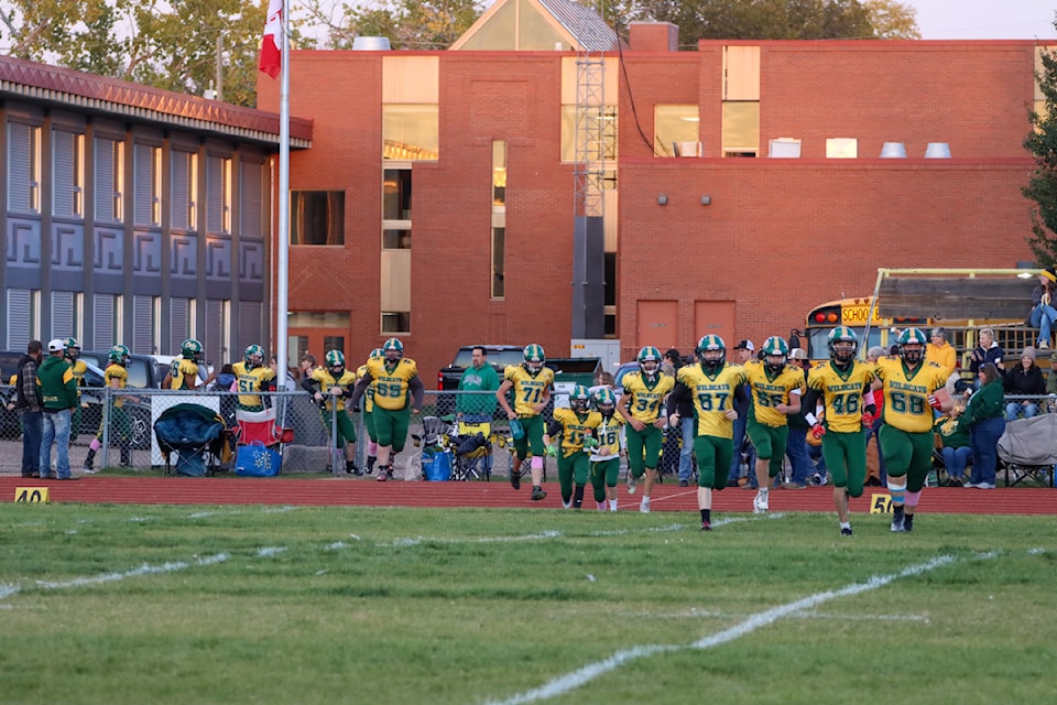 The Stettler Wildcats take the field in the game against the HJ Cody Lakers.