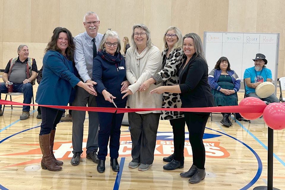 Members of the Okanagan Skaha School Board cut the ribbon to open the new gym at Summerland Secondary School. From left are Barb Sheppard, Dave Stathers, Linda Van Alphen, Shelley Clarke, Karen Botsford and Tracy Van Raes. Missing is board chair James Palanio. (John Arendt/Summerland Review) 