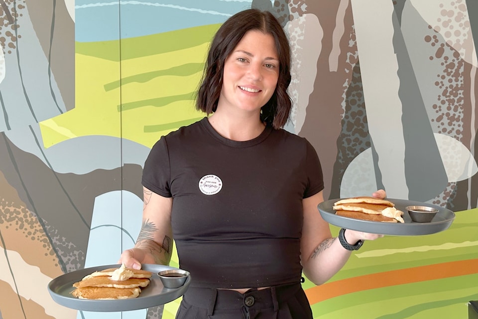 Shannon McMichael of Giant’s Head Brewing serves diners at the third annual pancake breakfast fundraiser on Nov. 30. The fundraiser collected donations to support the Summerland Food Bank and Resource Centre. (John Arendt/Summerland Review)