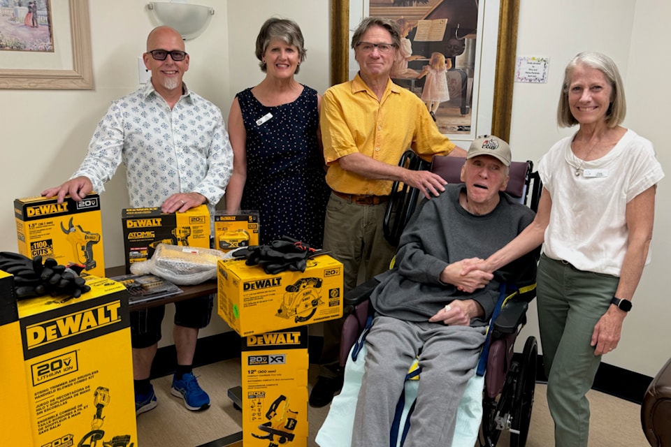Bonnar Dowler, seated, made a donation to Agur Lake Camp. From left are Michael Dowler, director Pat Cook, director Jim Ongena, Bonnar Dowler and camp society president Sue Filek. (Contributed)