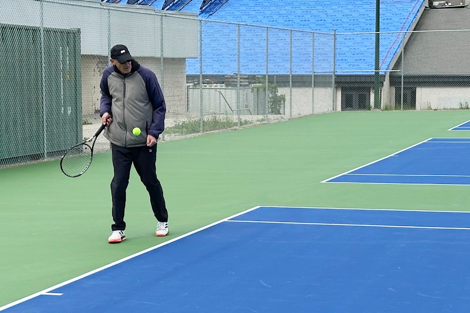 Mayor Doug Holmes tests out the new tennis courts at Summerland Secondary School. In mid-June, these courts, in addition to the courts at Lakeshore Racquets Clubs, were used for a tennis tournament. (John Arendt/Summerland Review)