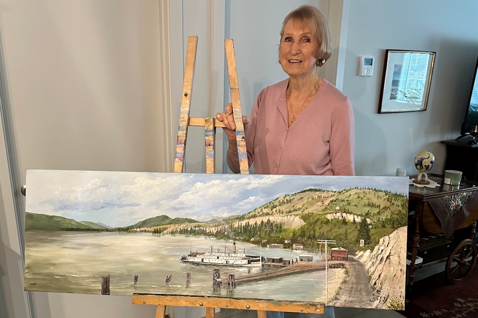 Janice Cornett-Ching shows an image she created from a 1912 photograph showing Summerland㽶Ƶֱs waterfront. (John Arendt/Summerland Review)