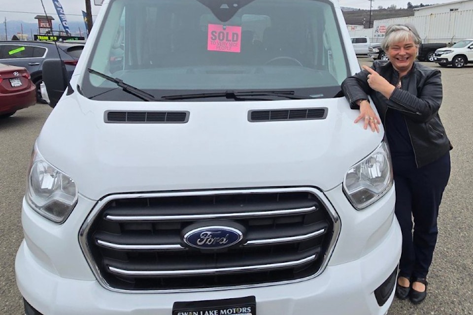 Charmaine Kramer, chief executive officer of Parkdale Place Housing Society, shows a new passenger van acquired for the seniors’ care facility. (Contributed)
