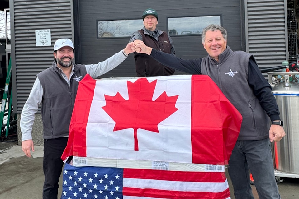 Lightning Rock Winery in Summerland recently sent its first shipment to Washington State. Pictured from left are Washington State agent Craig Pacheco of Vin-Vinstar, winemaker Sebastian Hotte and owner Ron Kubek.