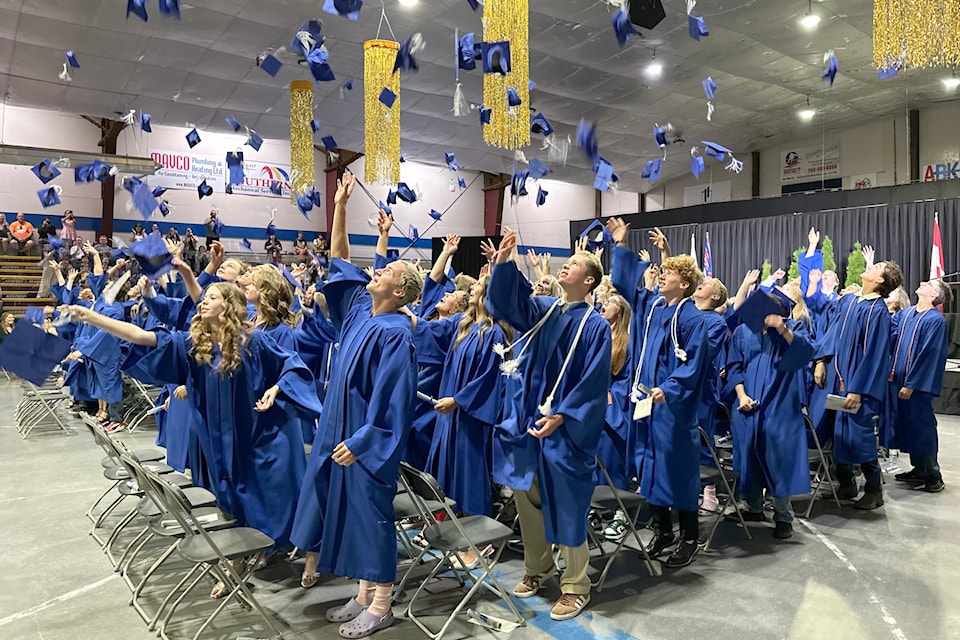 Summerland Secondary School’s graduates of 2025 toss their hats at the conclusion of the high school’s graduation ceremony on June 23. 
