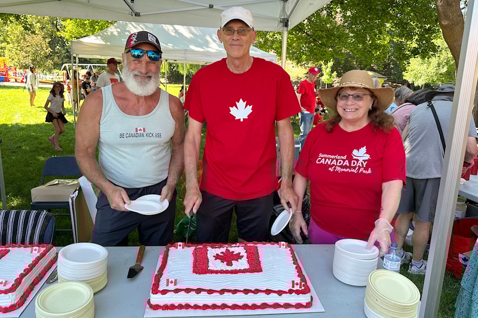 Coun. Marty Van Alphen, left, Mayor Doug Holmes and Debbie Lawrie of the Summerland Legion prepare to serve cake in honour of Canada’s 158th birthday on Canada Day, July 1. 