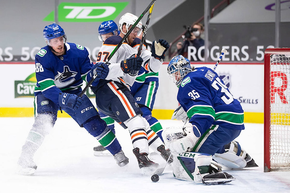 24516810_web1_210313-CPW-Canucks-Oilers-demko_1