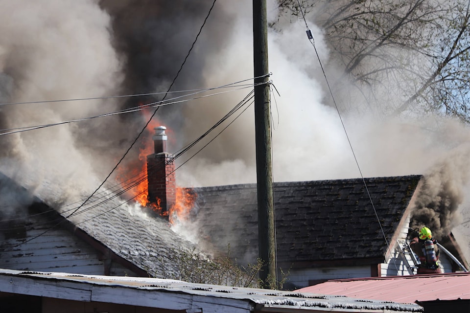 Firefighters battled a burning home on farmland in the north end of Vernon Saturday, April 17, 2021. (Brendan Shykora - Morning Star)