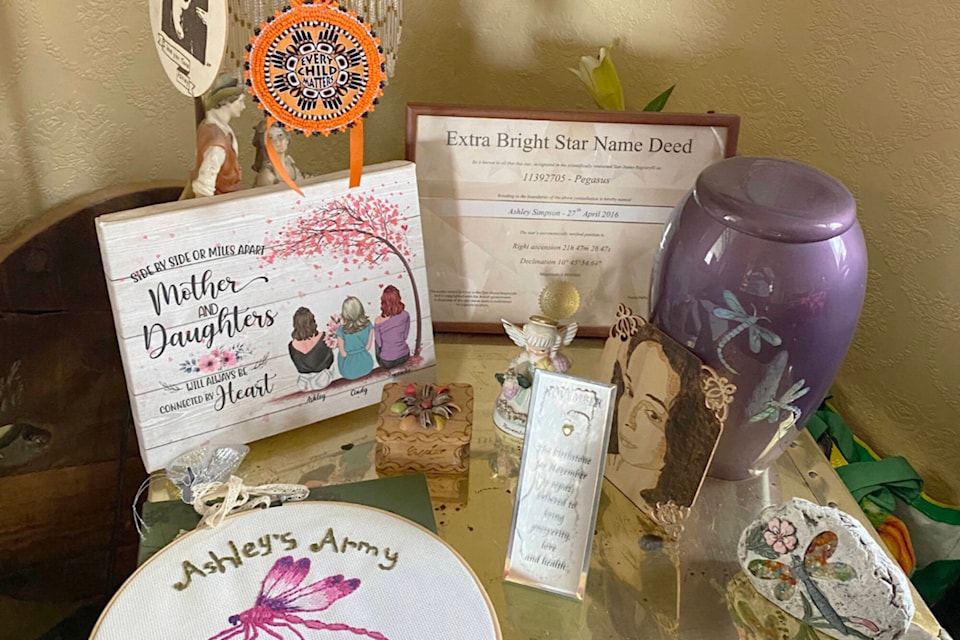 The purple urn in the Simpson family home holding Ashley Simpson’s remains sits nestled among special items saved or given to the Simpson family marking the disappearance and death of their beloved Ashley. Ashley disappeared from Yankee Flats Road near Silver Creek in April 2016 and her remains were discovered near Salmon Arm in November 2021. (Photo contributed)
