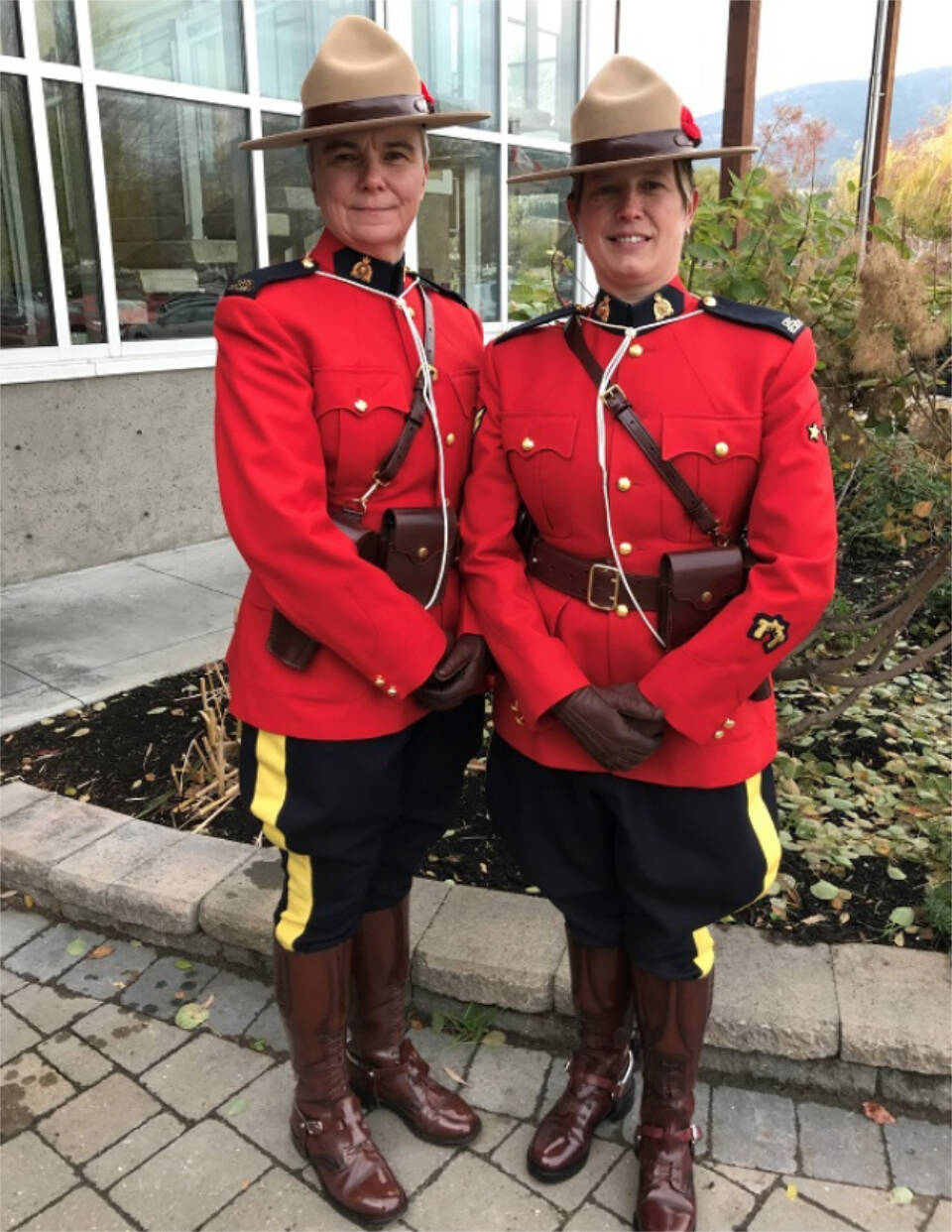 Cpl. Heather Bradshaw (left) and her partner Const. Barrett. Bradshaw is a watch commander with the Penticton RCMP who shares her message during Pride month. (Penticton RCMP)