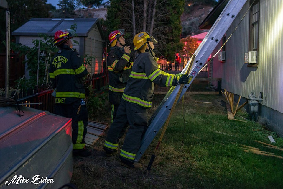 Penticton fire crews responded to an attic fire on Norton Street on Friday night, July 29. (Photo- Mike Biden, Twitter)