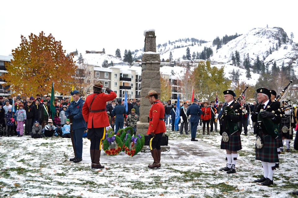 RCMP, including retired officer Roch Fortin, lay a wreath at the Summerland cenotaph. (Monique Tamminga Black Press)