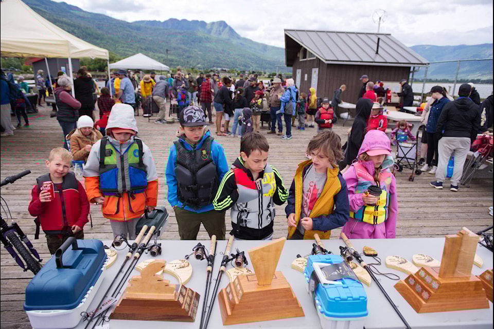 Young anglers check out the prizes to be won at the Salmon Arm Kids㽶Ƶֱ Fishing Derby held at the end of the Marine Park wharf on Sunday, June 18, 2023. (Lachlan Labere-Salmon Arm Observer)