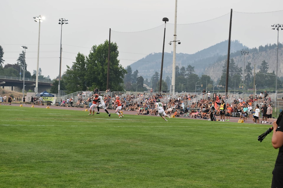 The Okanagan Sun honoured their storied past by raised banners for the franchise’s three national titles before the 2023 home opener at the Apple Bowl on Saturday night, Aug. 5. (Jordy Cunningham/Capital News)