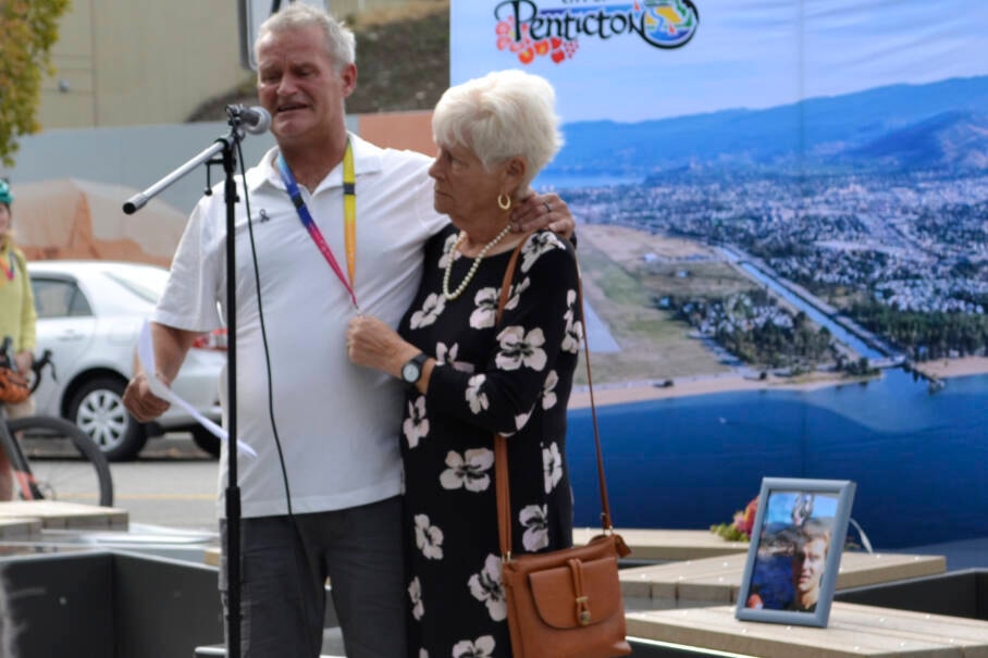 An emotional Gord Portman with his mom Pam at the unveiling of a memorial bench on Marina Way in Penticton that honours lives lost to the overdose crisis. (Monique Tamming Western News)