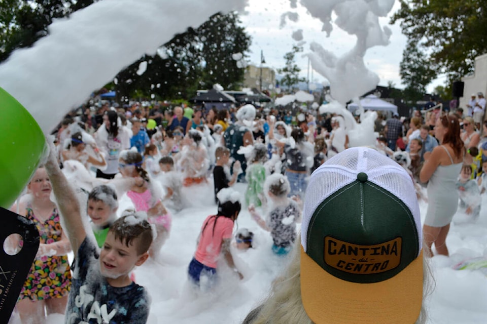 Over 100 enjoy the fun of the foam party held at Gyro Park in Penticton on Sunday as an end of the summer bash and fundraiser for wildfire relief. (Monique Tamminga Western News)