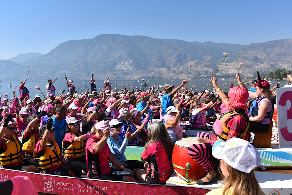 Nine teams from across B.C. took part in the pink carnation ceremony to honour survivors, those fighting and those lost to breast cancer at the Penticton Dragonboat Festival taking place on Sunday. (Monique Tamminga Western News)