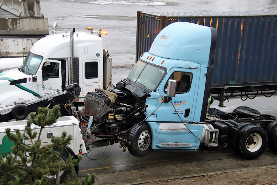 A semi-truck involved in a fatal collision on the Pattullo Bridge Friday night (Feb. 14) is towed away on Saturday. The bridge has reopened after being closed overnight for investigation.