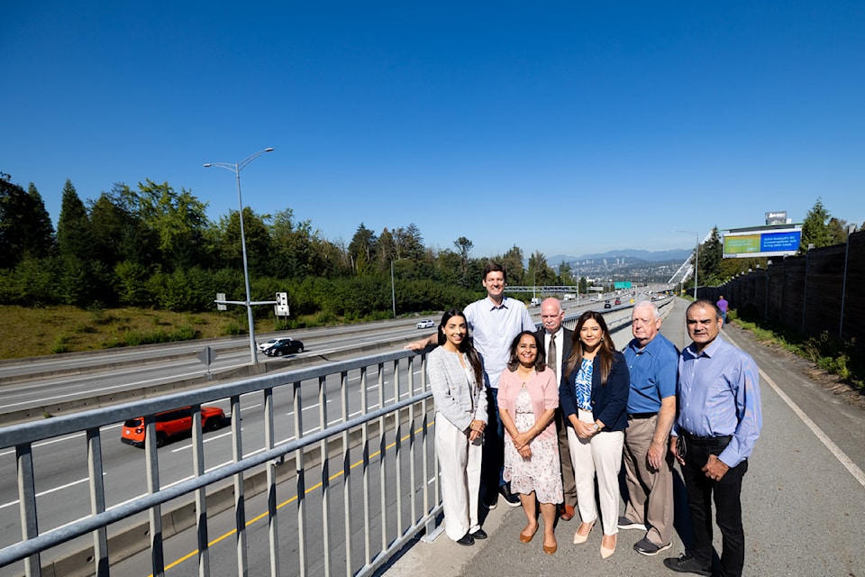 Premier David Eby, with Surrey NDP candidates, revealed his new campaign billboard in Surrey on Friday, Aug. 30, 2024.