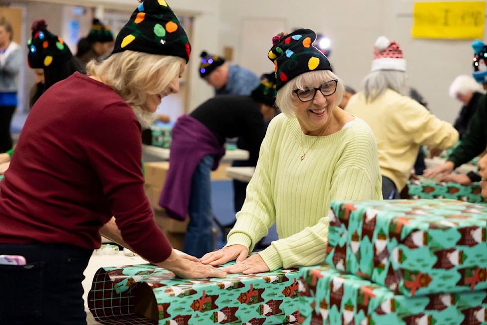 Hundreds of volunteers helped pack 2,600 gifts for children in inner city schools in Surrey on Saturday, Dec. 7, 2024 at North Surrey Secondary in Surrey. 