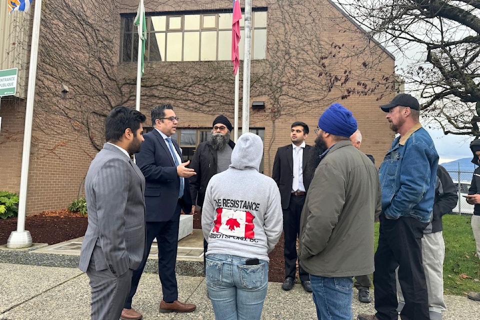 Bill Shoker with his lawyers and some of his supporters outside of the Chilliwack RCMP detachment on Airport Road Wednesday (Dec. 18).
