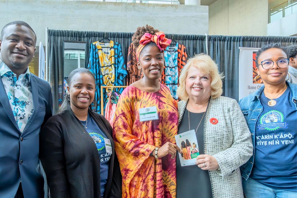 Adebola Ige, left and Mayor Brenda Locke pose for a photo with one of the many businesses at the Metro Vancouver Black Business Expo in Surrey on Oct. 26, 2024. 