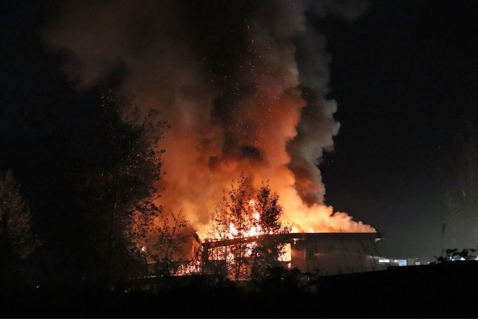 A two-storey home in Cloverdale was fully engulfed in flames when Surrey fire crews arrived late Friday night (Sept. 20).