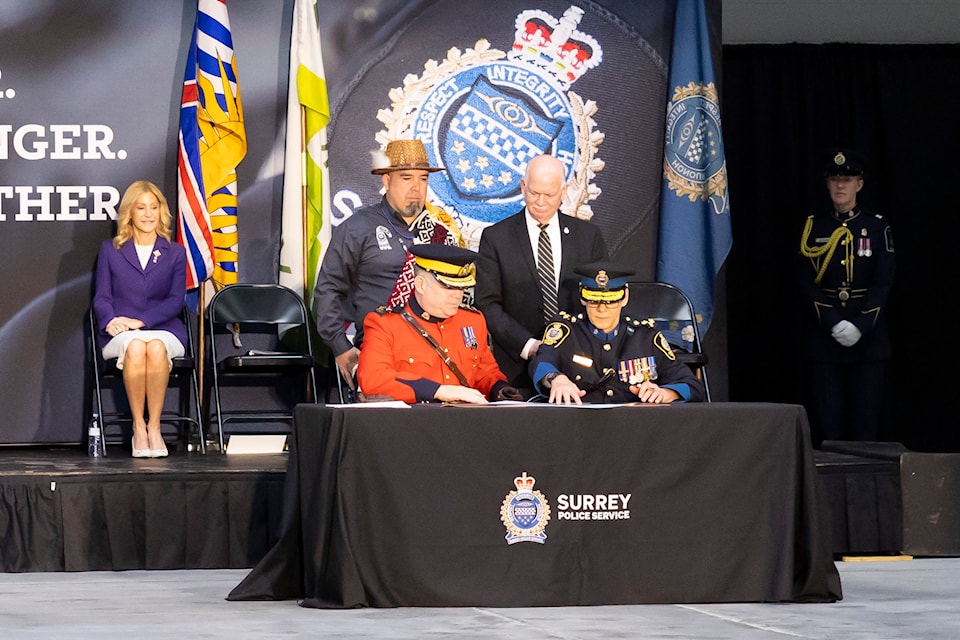 Deputy Commissioner Dwayne McDonald, Commanding Officer, BC RCMP and Chief Constable Norm Lipinski's signing the Change of Command Parchment at the Surrey Police Service at the Surrey Police Service Change of Command Ceremony in Surrey on Tuesday, April 22, 2025. 
