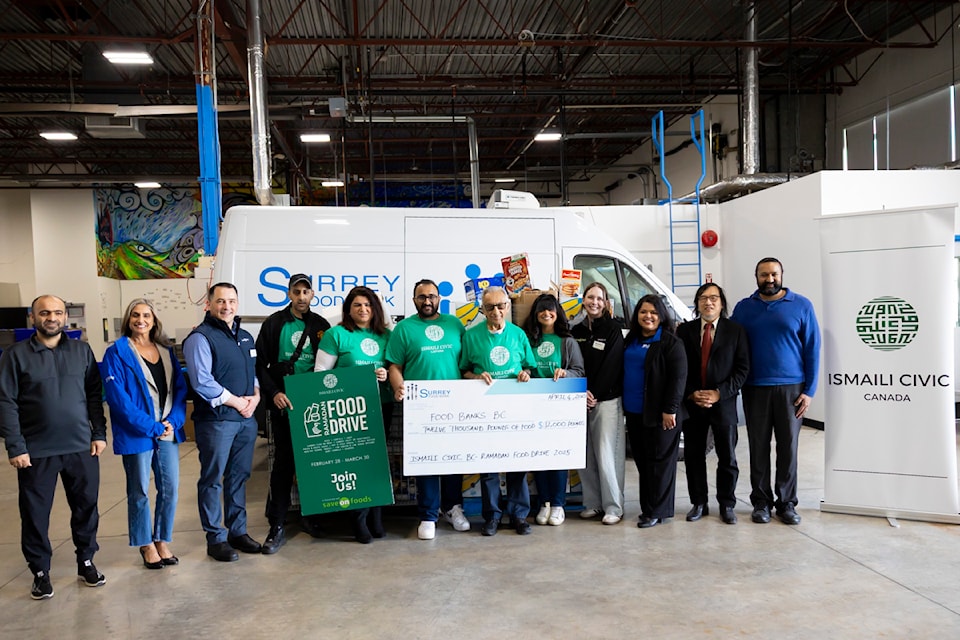 Partners from St. Monica's Roman Catholic Parish, Staff from Surrey Food Bank, Save-On Foods Sunwood, Manager, Israel Martins, Volunteers from Ismaili CIVIC, Save-On Foods Willingdon, Assistant Manager- Brooklyn Murphy, Hajira Hussein, Executive Director of Richmond Food Bank, Partners from St. Monica's Roman Catholic Parish and  Staff from Surrey Food Bank pose for a photo at Surrey Food Bank on Friday, April 4, 2025 in Surrey. 