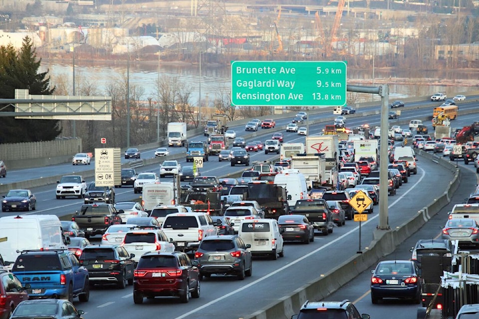 Emergency responded to a two-vehicle traffic collision with a rolled Chevy SUV in the HOV lane on the Port Mann Bridge in Surrey on Jan. 23, 2024. 